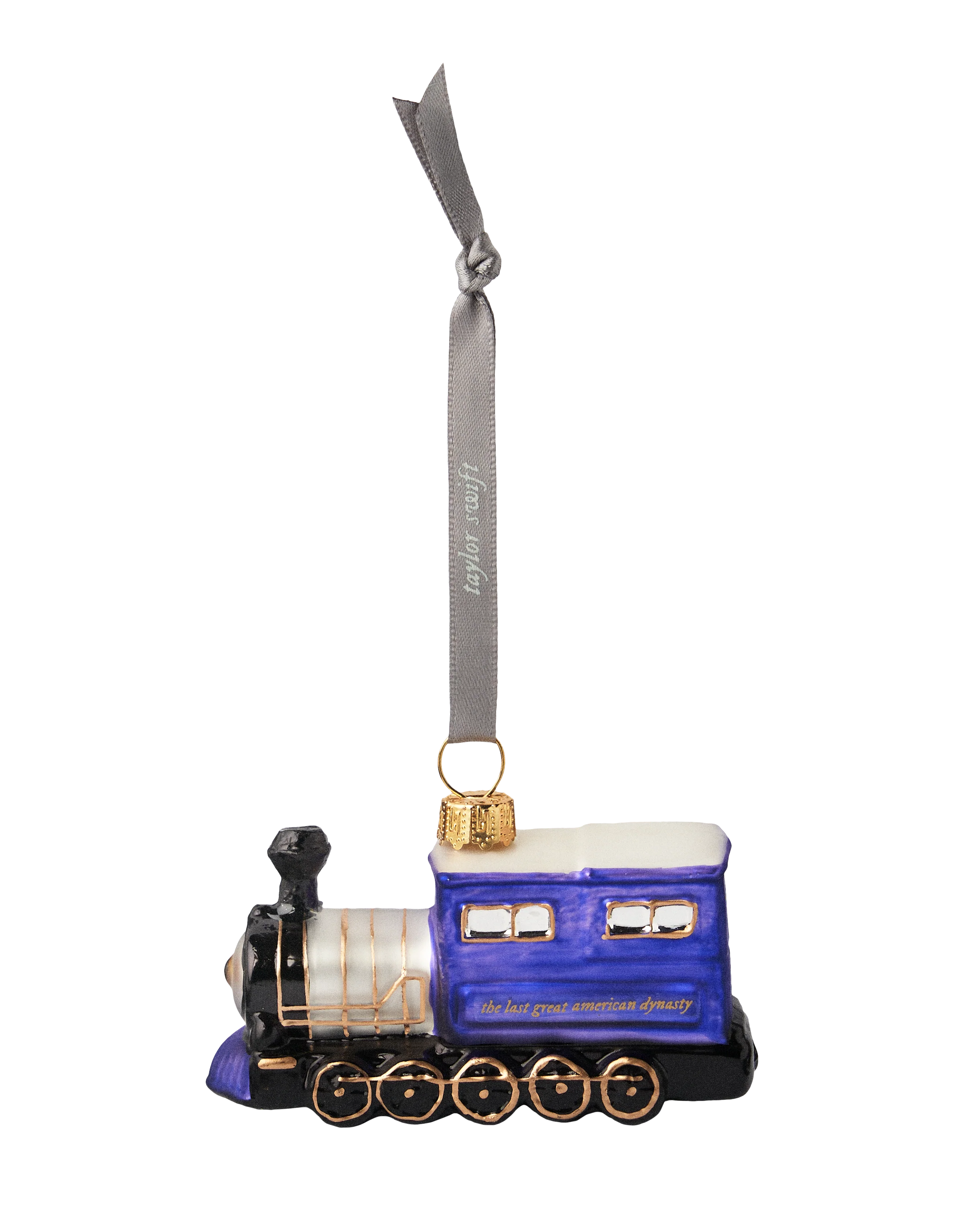 Decorative train ornament with a blue engine and gold accents on a white background