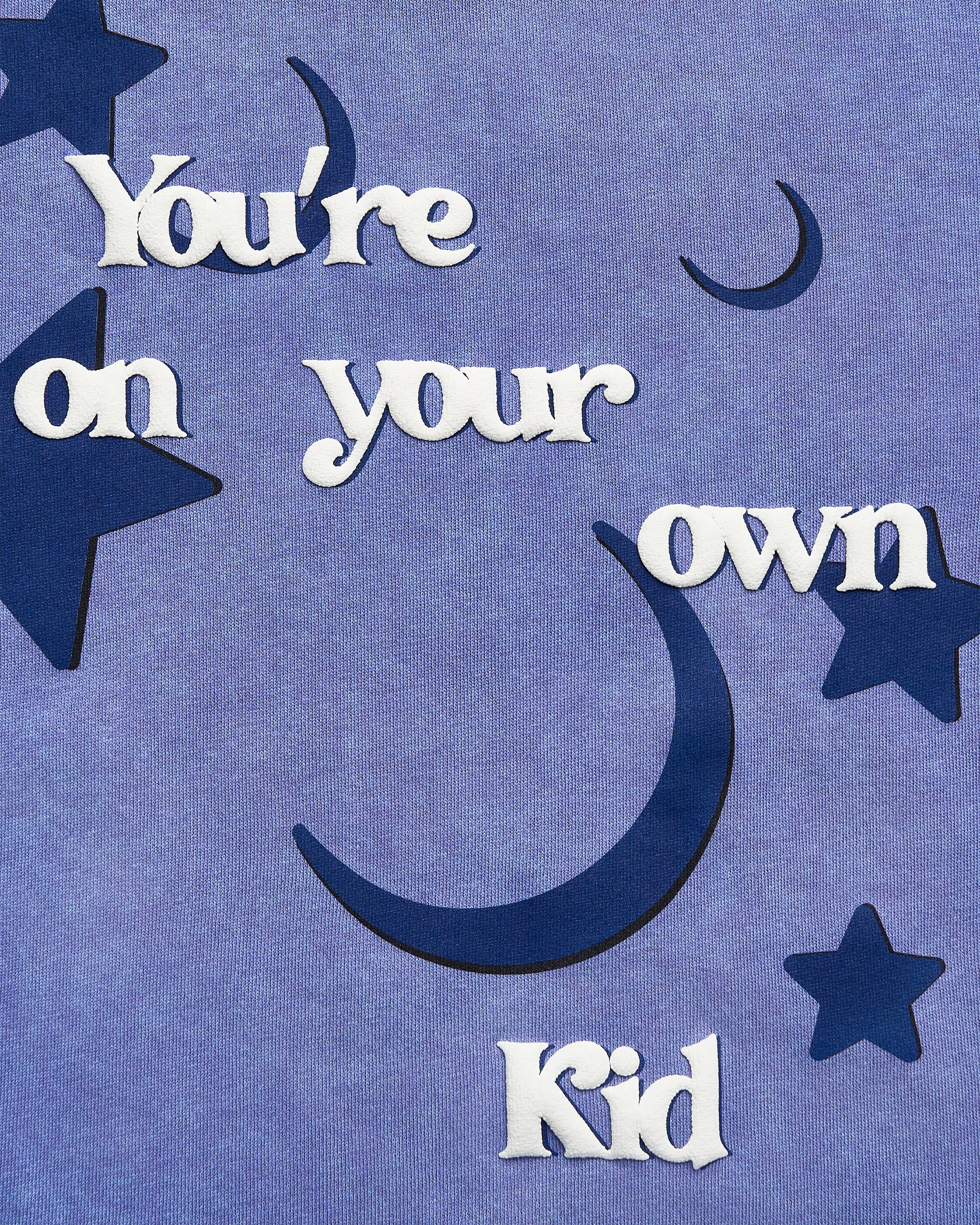 Text 'You're on your own Kid' with star and moon shapes on a lavender background
