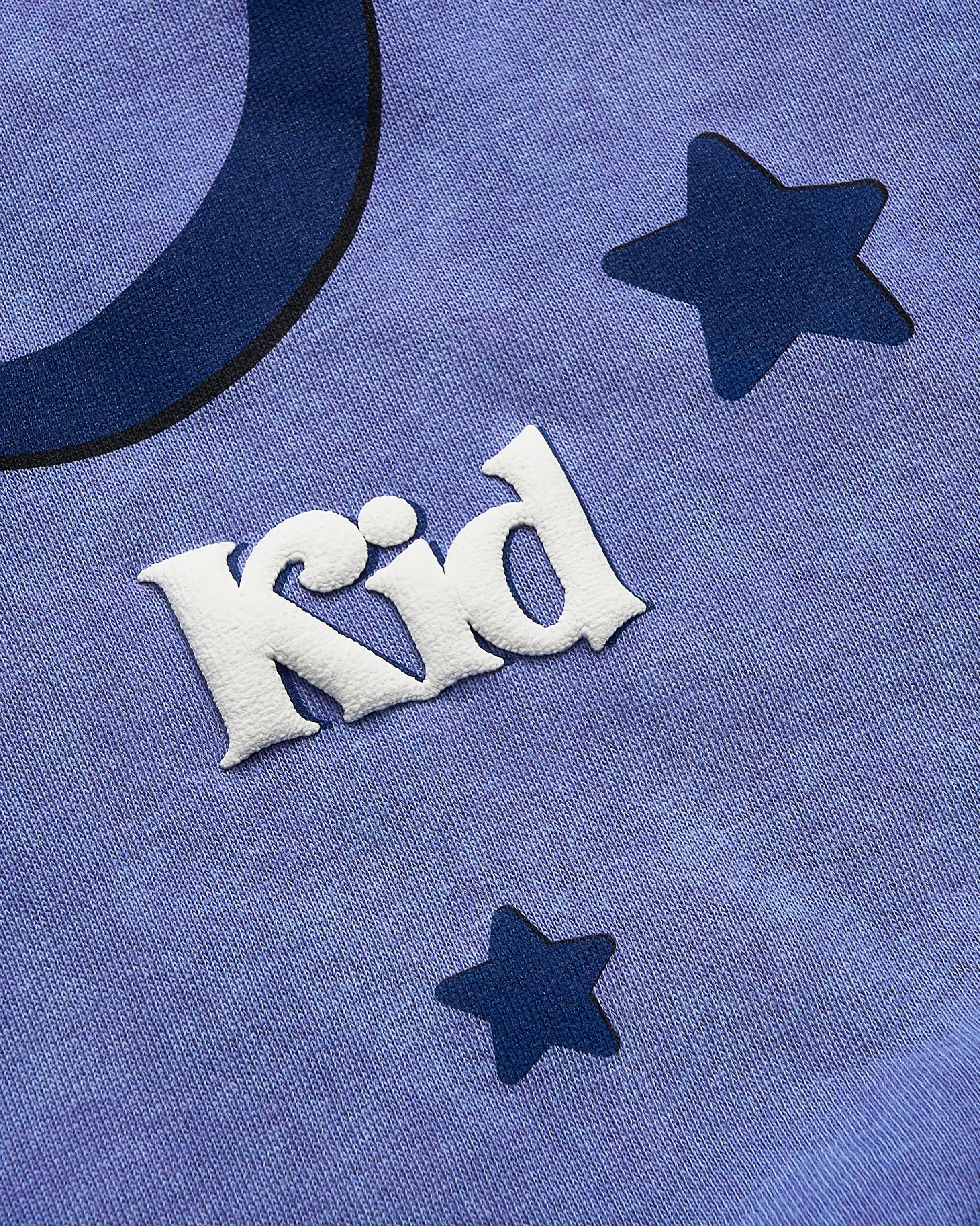 Lavender fabric with white embroidered text 'Kid' and star patterns