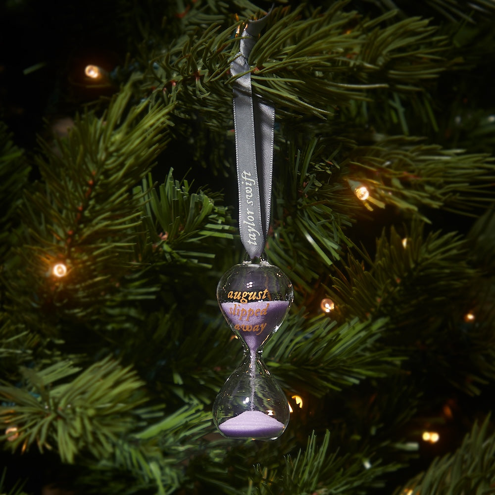 Folklore Album Hourglass Ornament on tree